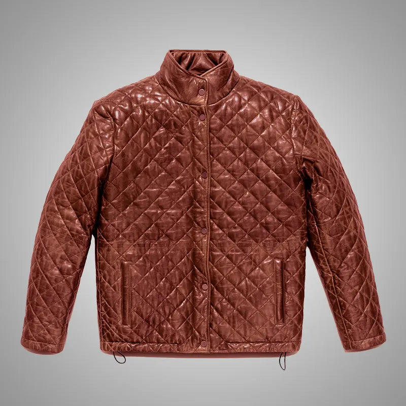 Quilted brown jacket on a gray background