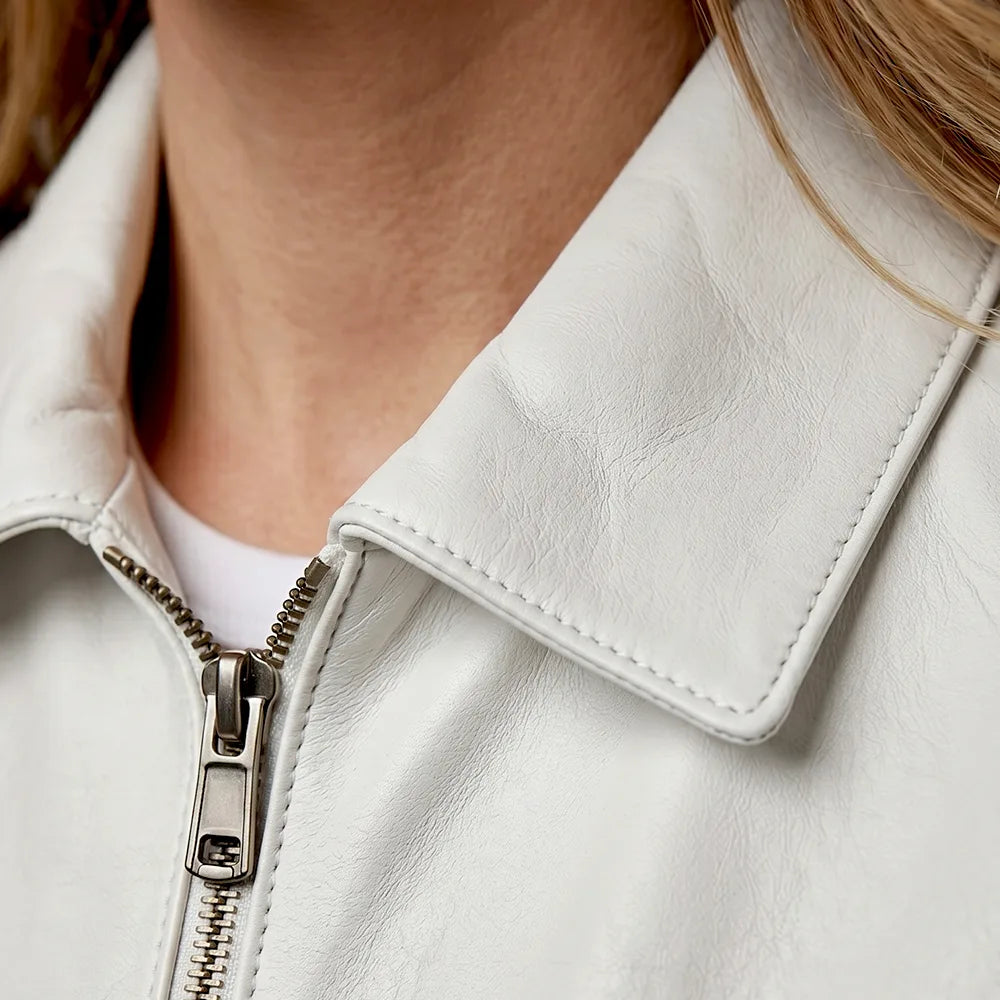 Women’s white lambskin leather jacket with a long point collar by CJ, showcasing smooth, high-quality leather and stylish design.