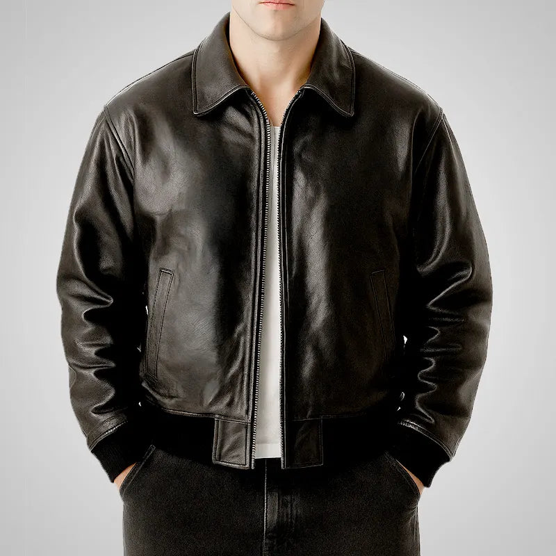 Black leather jacket worn by a person on a gray background