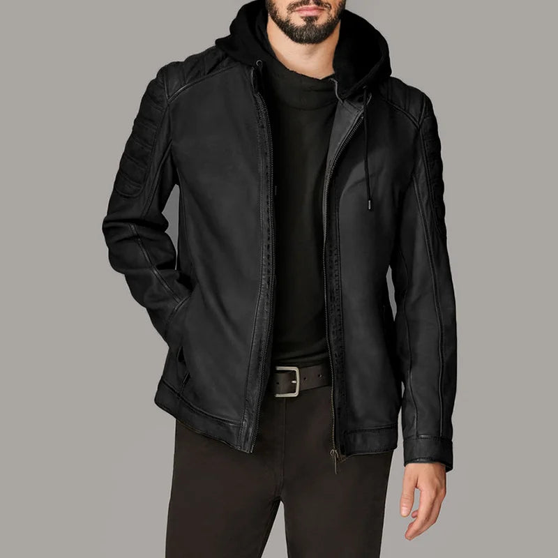 Man wearing a black leather jacket on a gray background