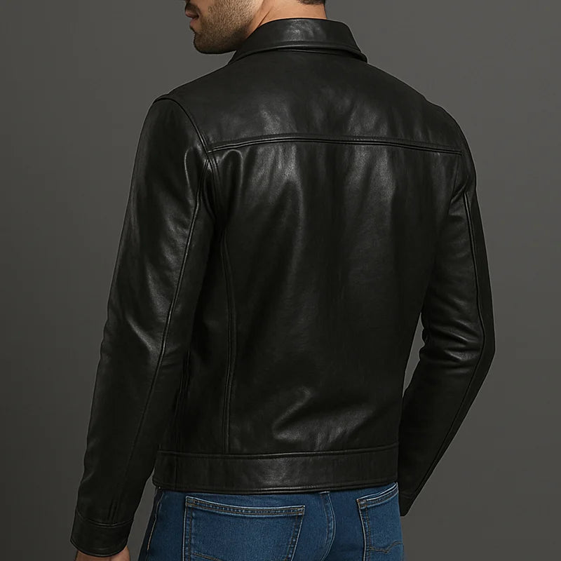 Man wearing a black leather jacket on a gray background
