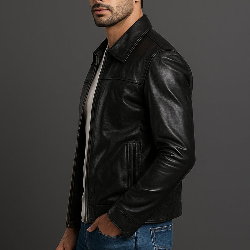 Man wearing a black leather jacket on a gray background