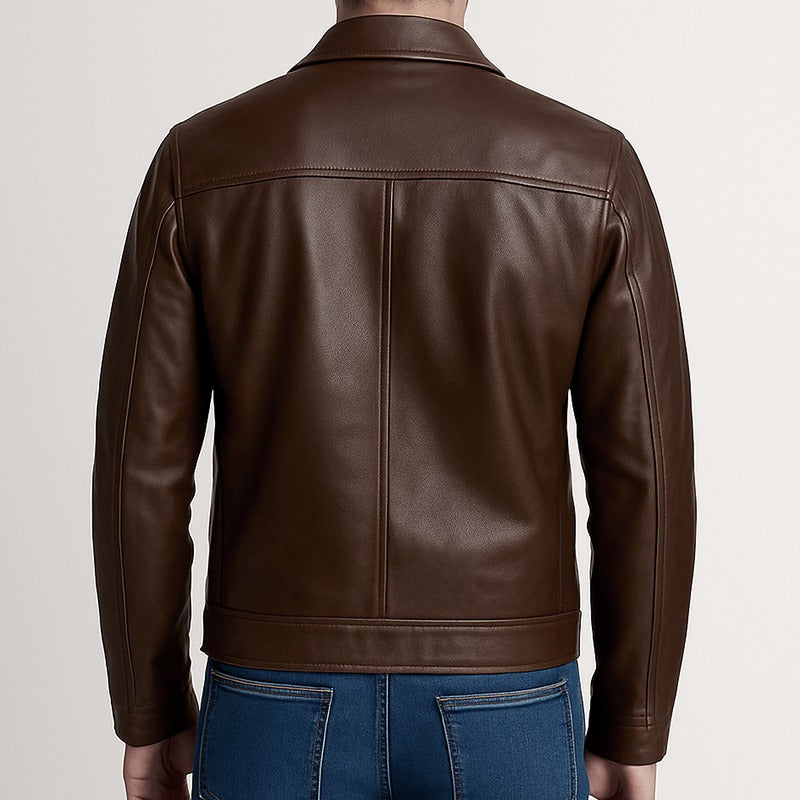 Brown leather jacket worn by a person on a plain background