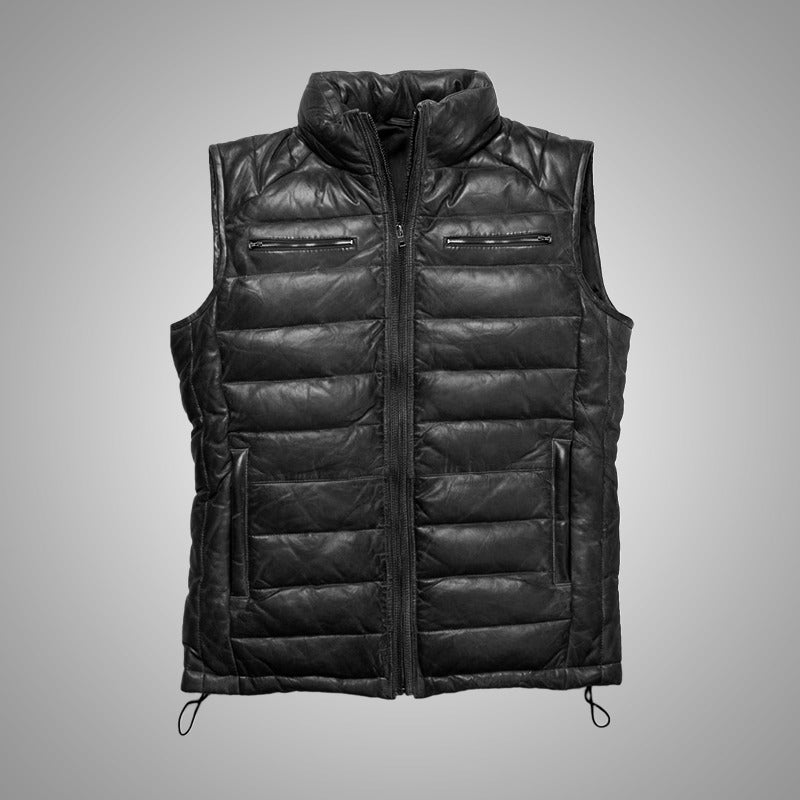 Black quilted vest on a gray background