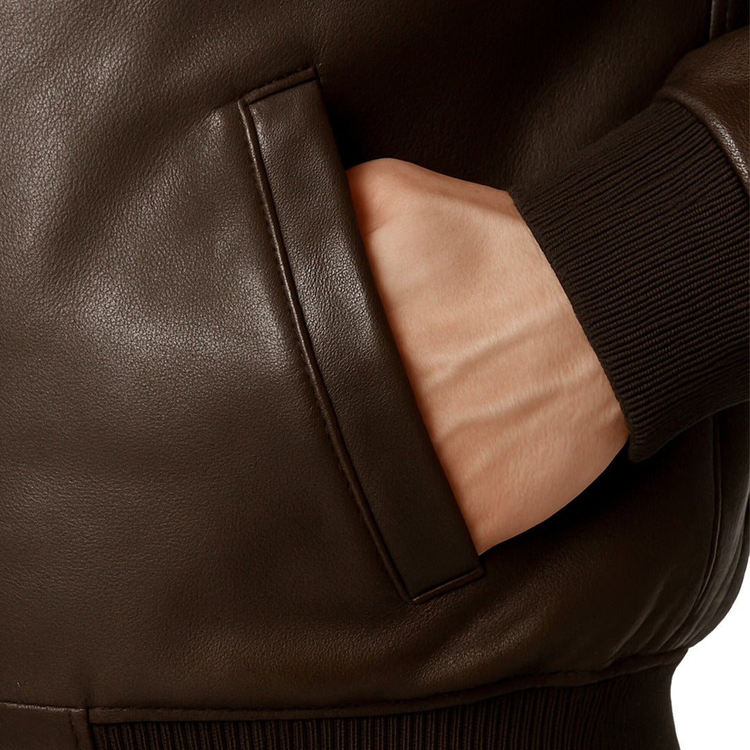 Close-up of a brown leather jacket with a pocket.