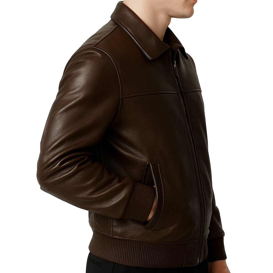 Brown leather jacket worn by a person on a white background