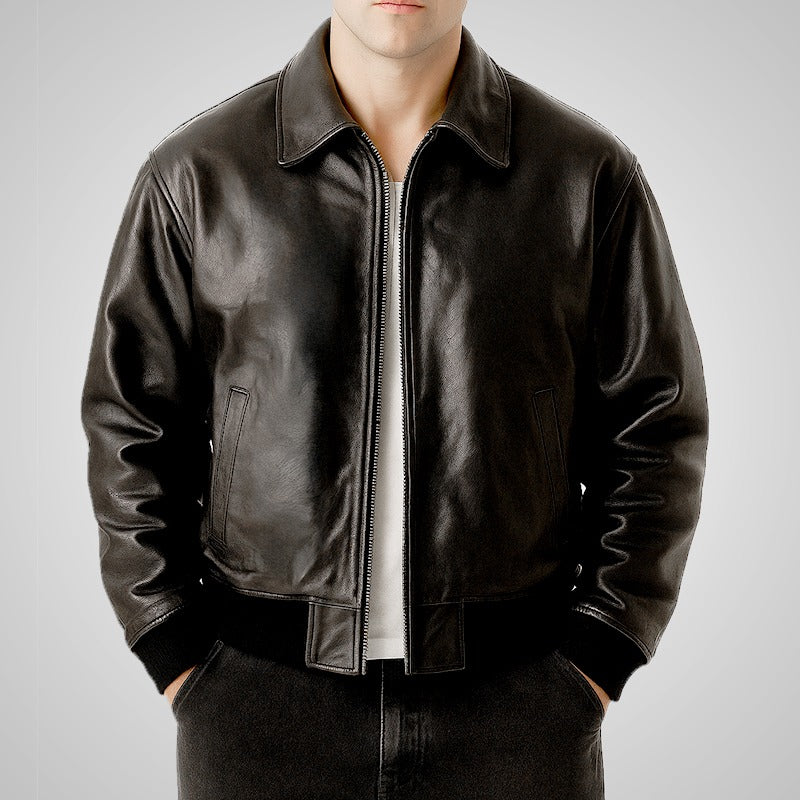 Black leather jacket worn by a person on a gray background