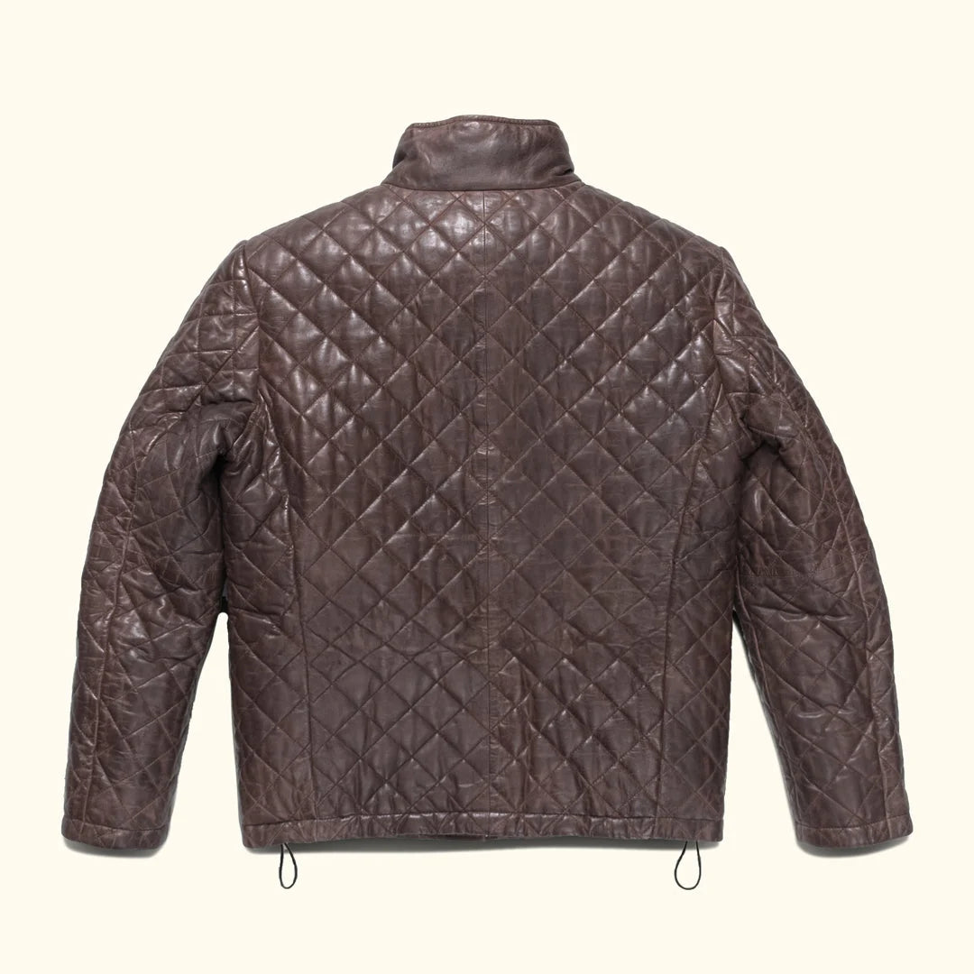 Quilted brown jacket on a white background
