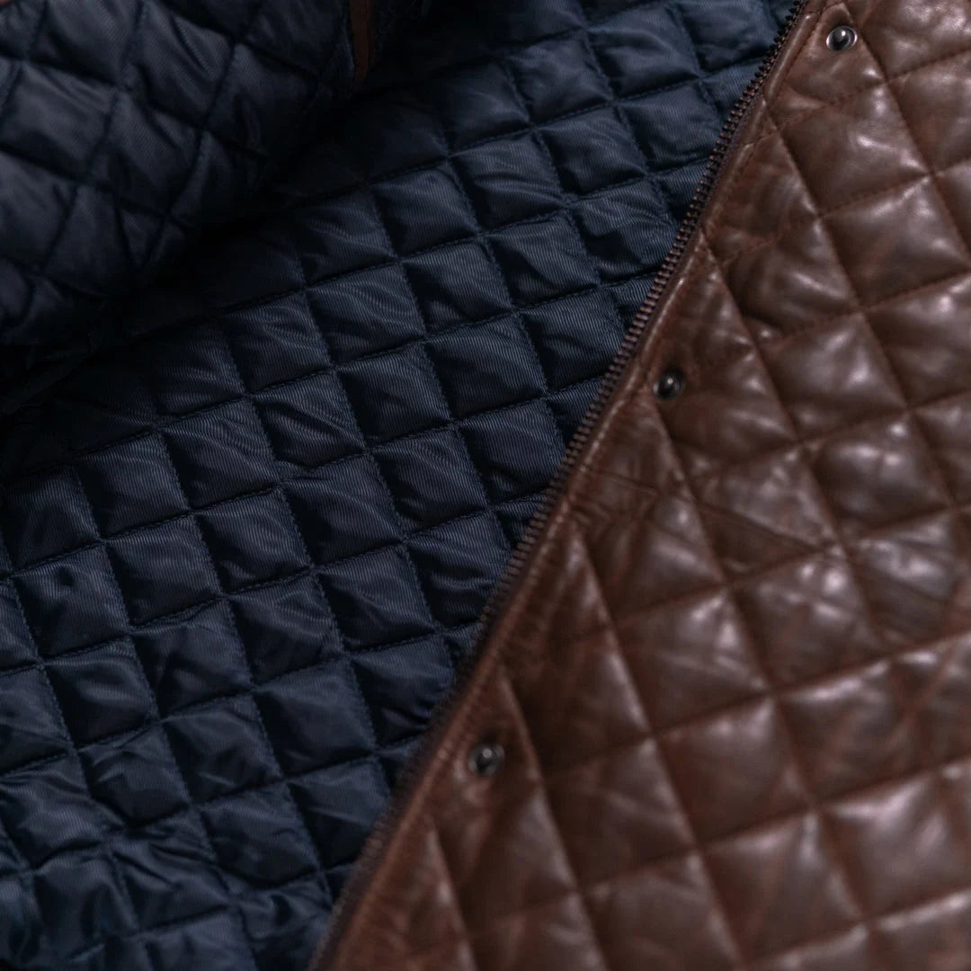 Close-up of quilted navy and brown fabric