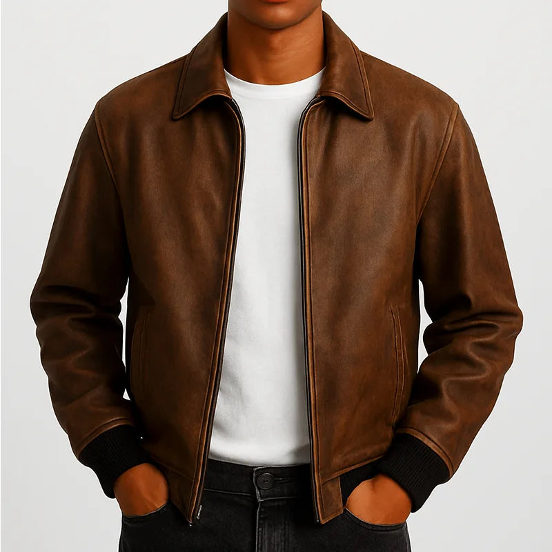 Brown leather jacket worn by a person on a light gray background