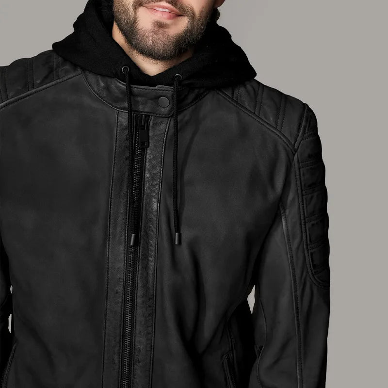 Black jacket with a hood on a neutral background