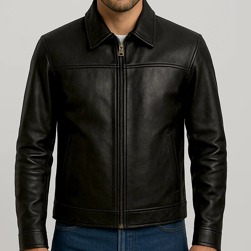 Black leather jacket worn by a person on a gray background