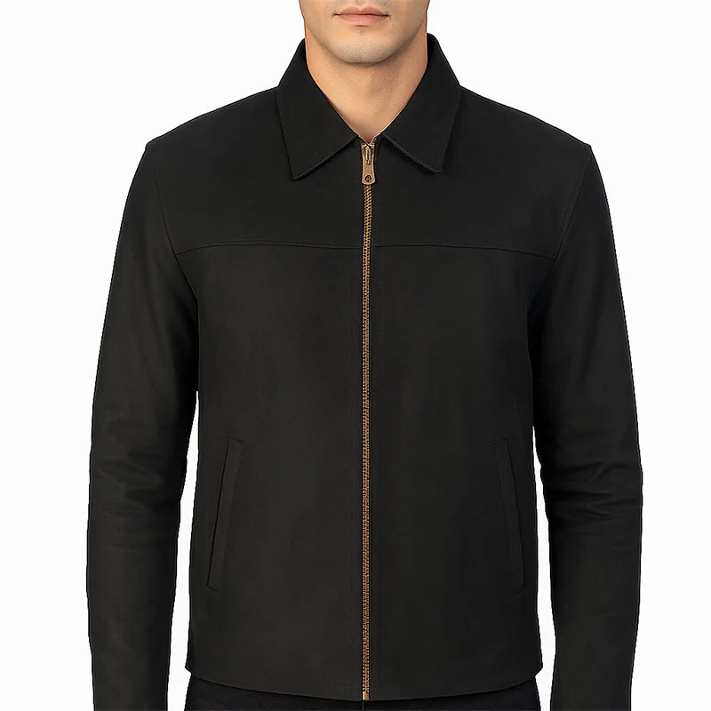 Black jacket with a gold zipper on a white background
