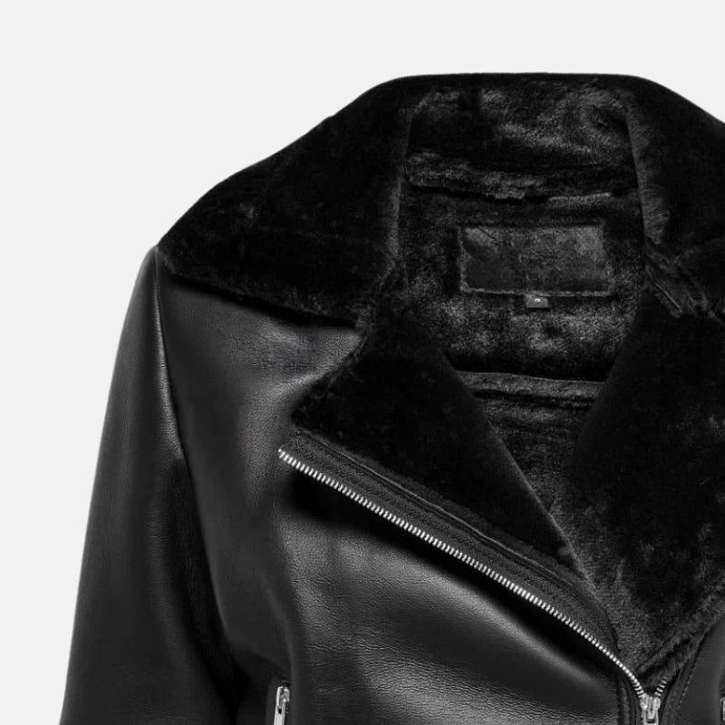 Black leather jacket with fur lining on a light gray background