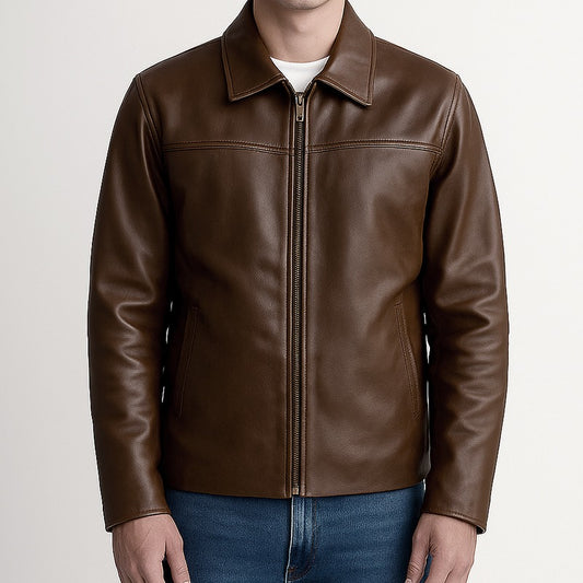 Brown leather jacket worn by a person on a plain background