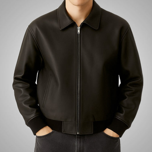 Black jacket worn by a person on a gray background