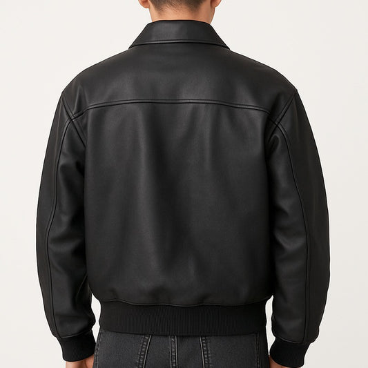 Black leather jacket worn by a person on a light gray background