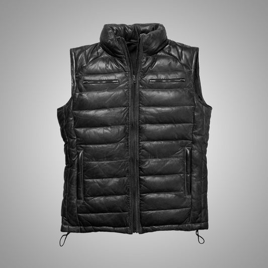 Black quilted vest on a gray background
