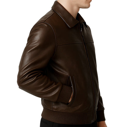 Brown leather jacket worn by a person on a white background